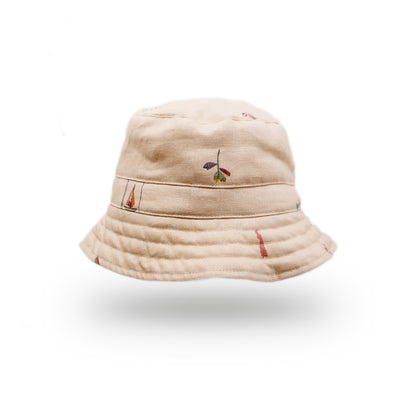 100% linen bucket hat in cream  Cream printed linen   Printed NF beach icons throughout  Made in LA