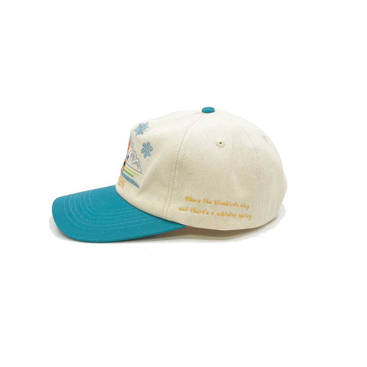100% cotton in Cream/Teal cap Multicolor embroidered 'Aspen' graphic Moustarde embroidered “Where the bluebirds sing and there’s a whiskey spring” message on side Embroidered matchstick on reverse side One size fits all Made in Los Angeles