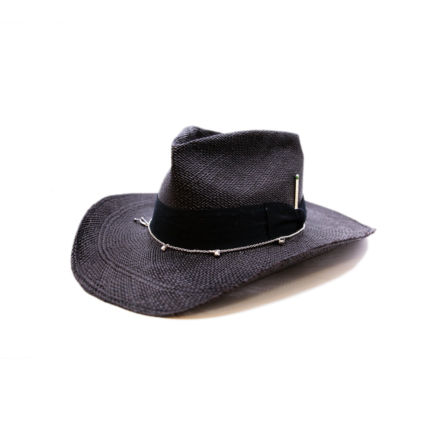 100% Ecuadorian straw hat in Black 1 ½” herringbone band & Bow Alternating silver chain with silver leaf accouterments Woven in Ecuador Western flanged brim Made in USA