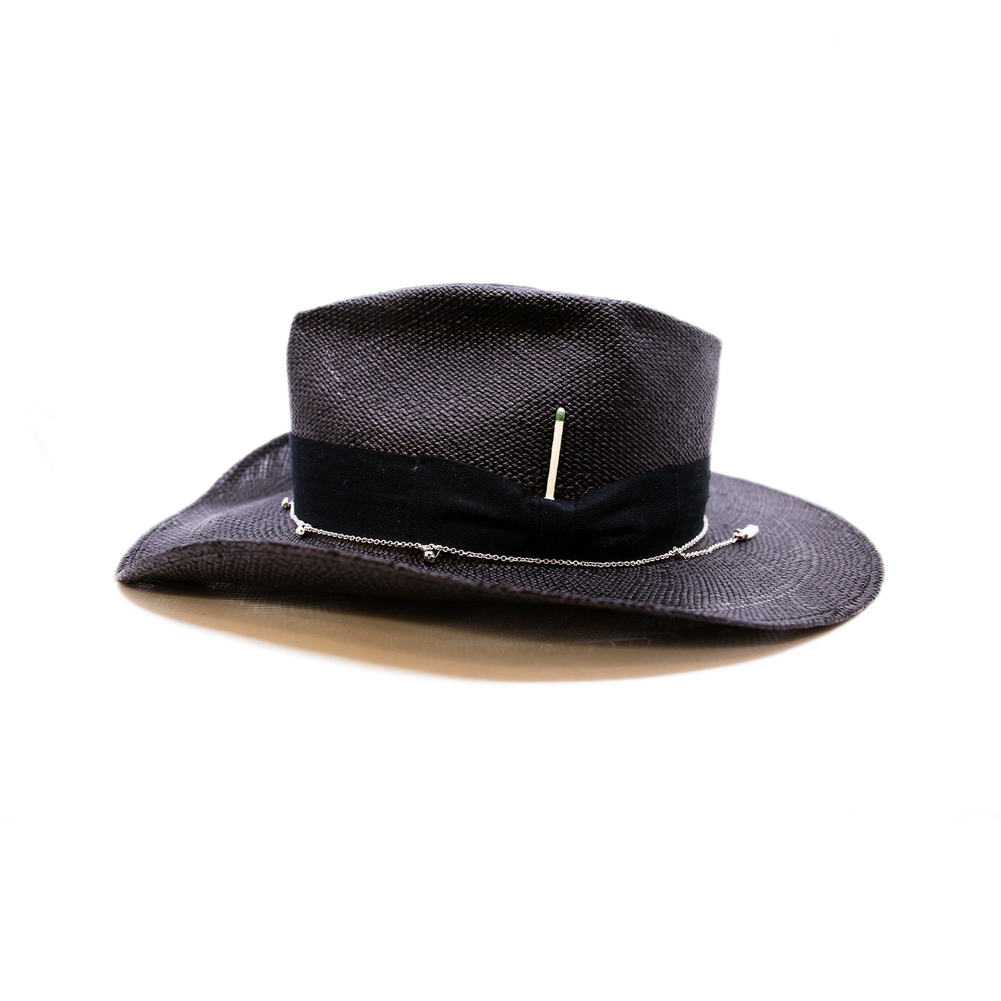 100% Ecuadorian straw hat in Black 1 ½” herringbone band & Bow Alternating silver chain with silver leaf accouterments Woven in Ecuador Western flanged brim Made in USA