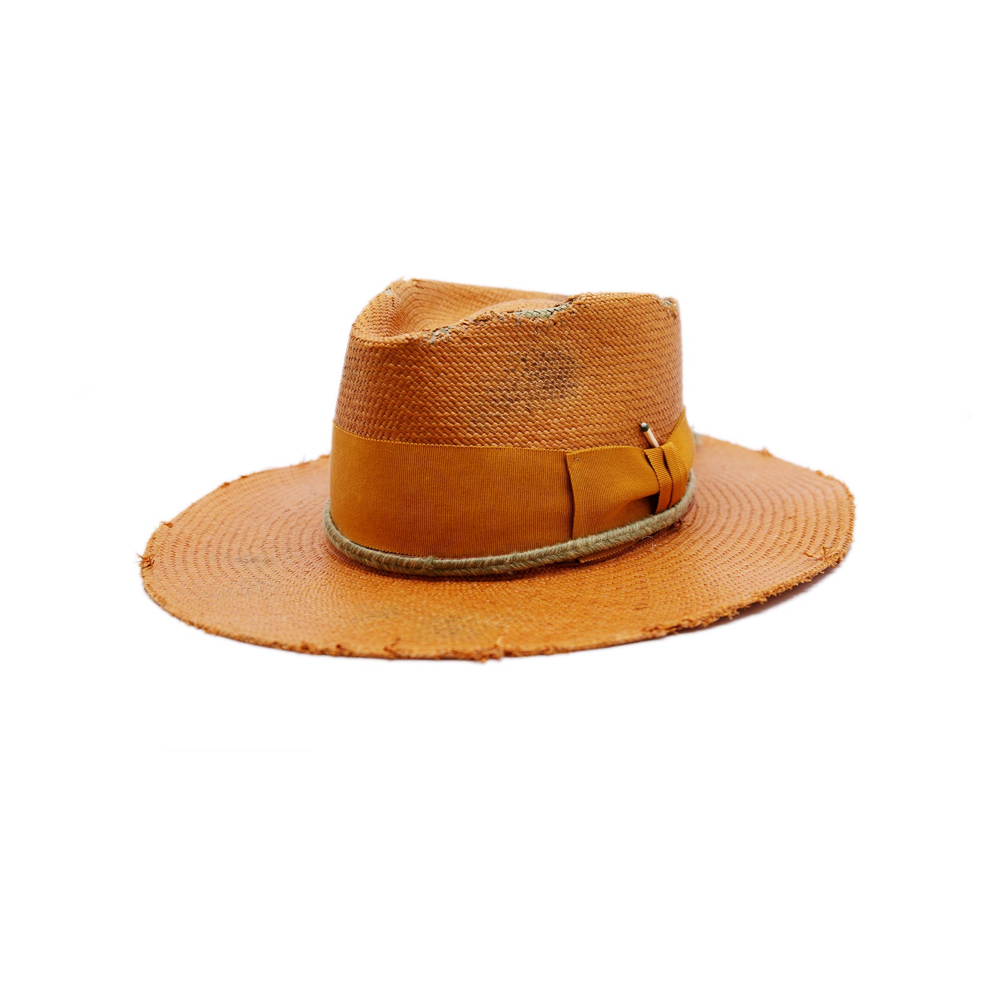 100% Ecuadorian straw hat in Tangerine 2” tonal grosgrain and woven herringbone 2-ply band and bow Distressed and inlay patchwork Woven in Ecuador Wavy brim Made in USA