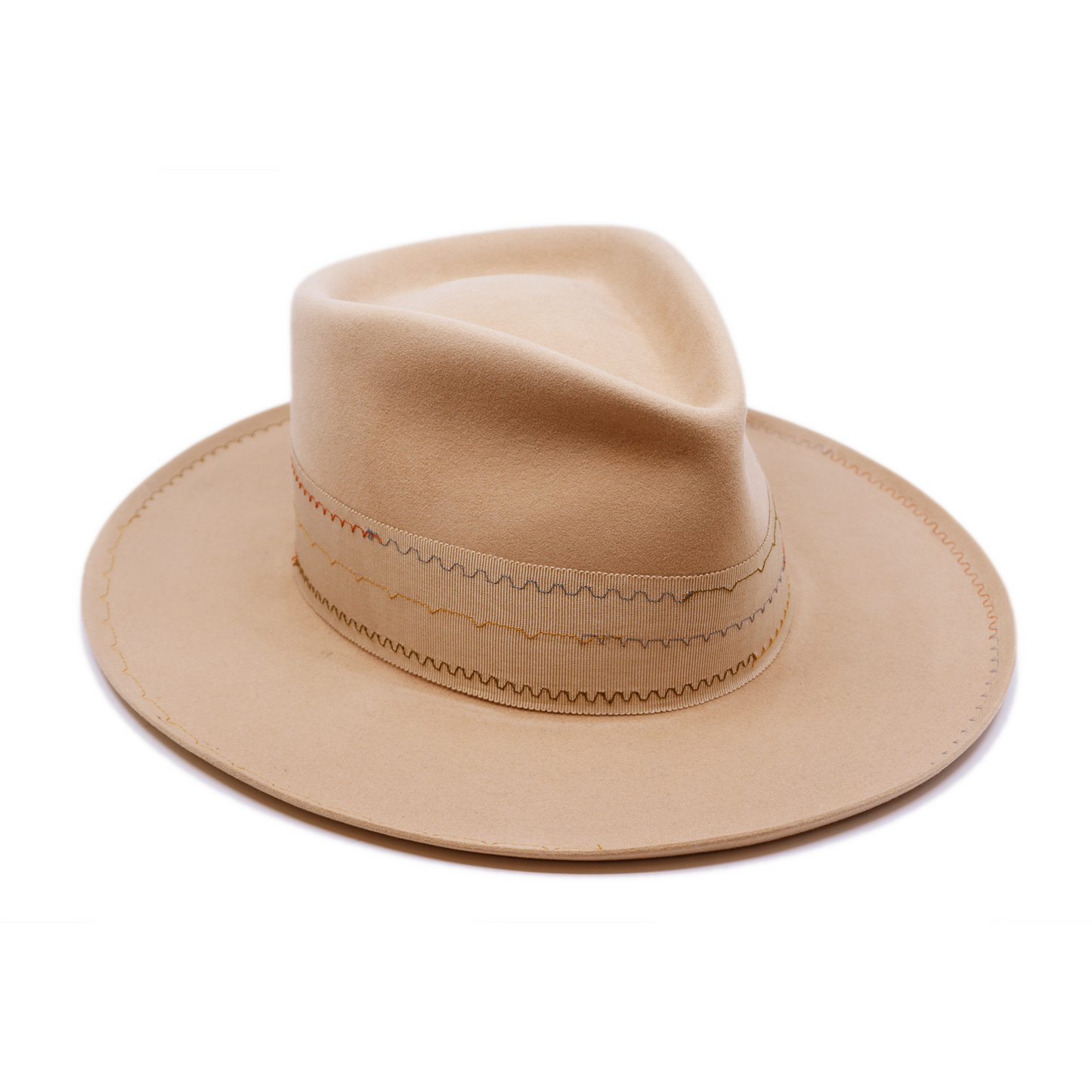 100% felt hat in Nude Western Weight 2” tonal grosgrain with zig zag multi color stitching on band 2" tonal grosgrain bow Multi colored zig zag stitching on brim Pencil curled brim Made in USA