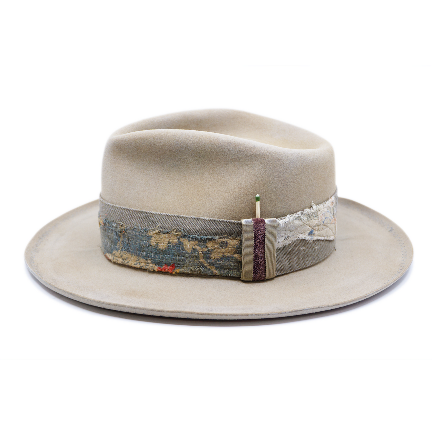 100% felt hat in Silver Belly Western Weight Coffee dye 2” multi fabric band Velvet with tonal grosgrain center bow Light blue zig zag stitching on brim Pencil curled brim Made in USA