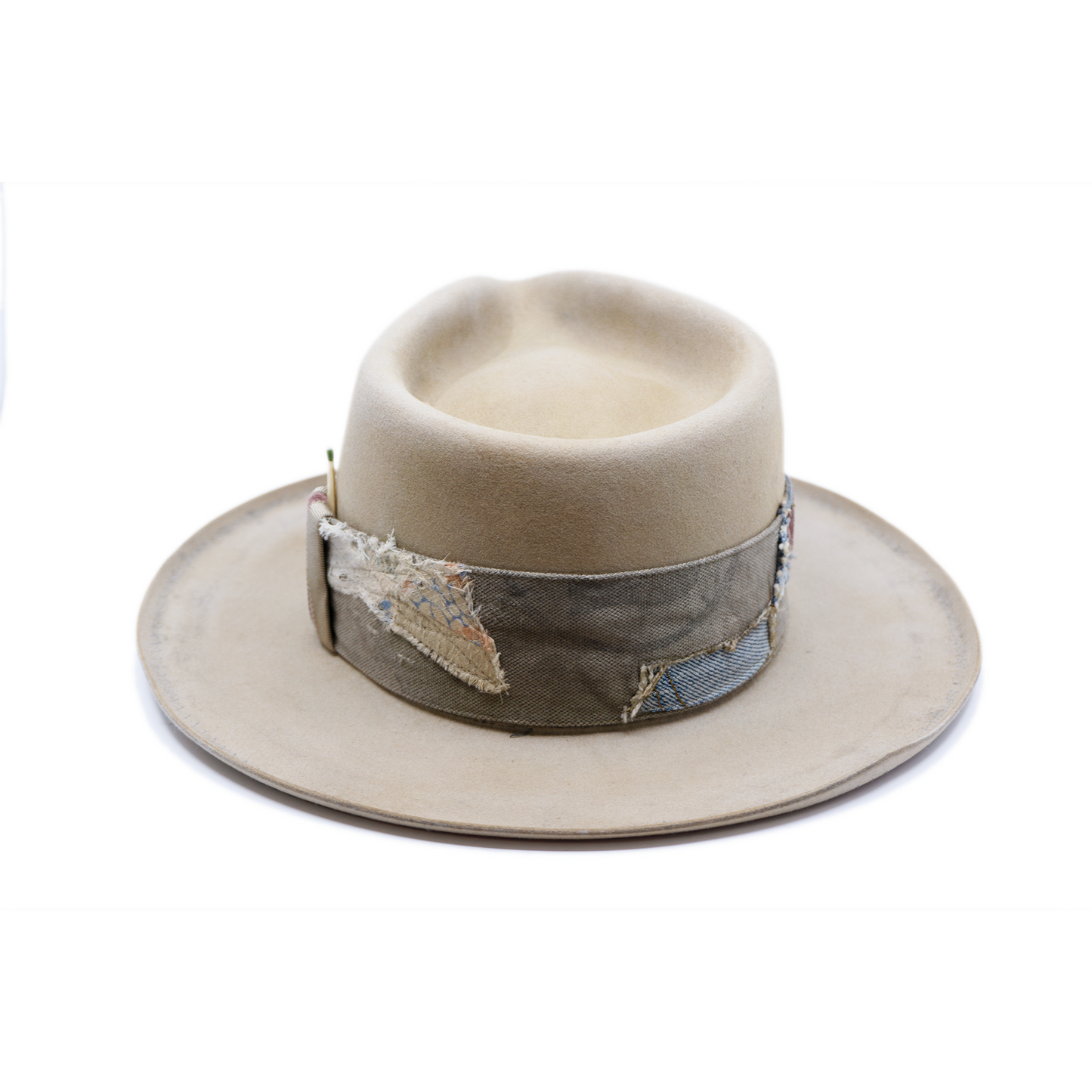 100% felt hat in Silver Belly Western Weight Coffee dye 2” multi fabric band Velvet with tonal grosgrain center bow Light blue zig zag stitching on brim Pencil curled brim Made in USA