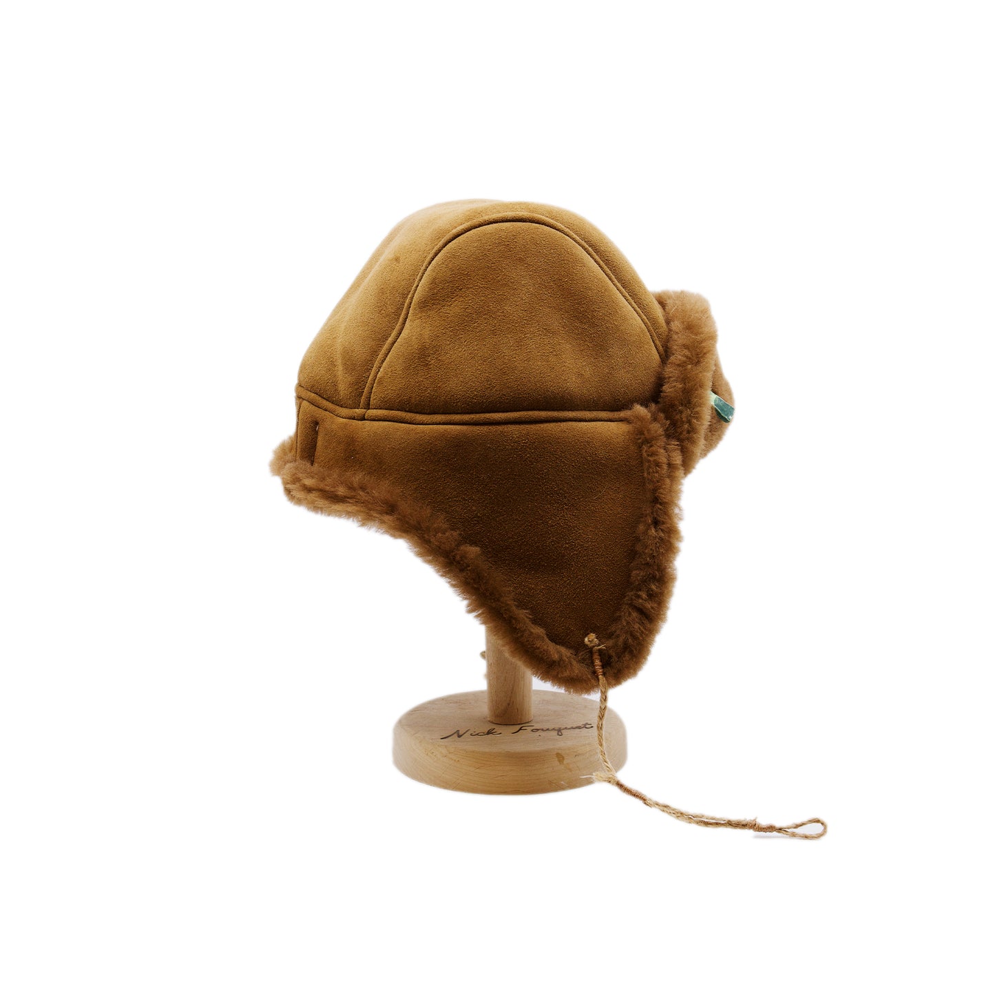 Aspen Highlands Trapper Hat Shearling Leather  Braided twine and metallic button closure  Gold plated and ceramic accouterments will vary from hat to hat  Made in Los Angeles