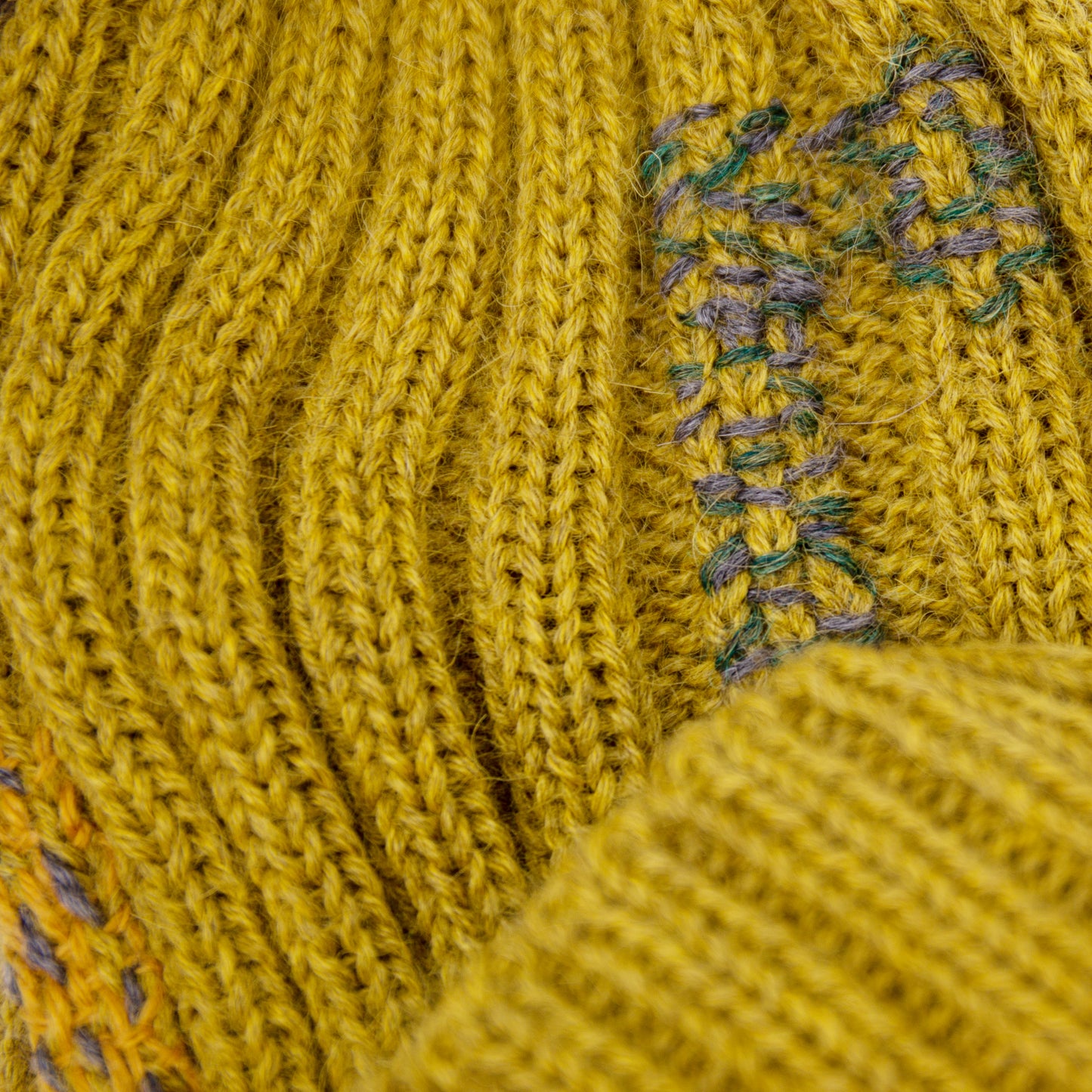 100% Baby Alpaca wool ribbed beanie in Olive Oil Multicolored hand-embroidered mending Made in Los Angeles
