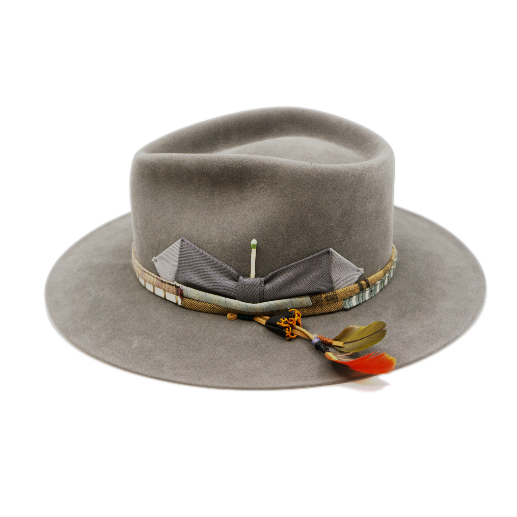 100% felt hat in Slate Grey  Western  Weight   ½” NF multi fabric band and cord   Double tonal grey grosgrain bow  Leather patches and molt harvested parrot feather   Flat brim  Made in USA 
