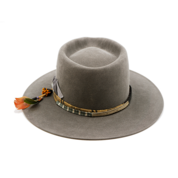 100% felt hat in Slate Grey  Western  Weight   ½” NF multi fabric band and cord   Double tonal grey grosgrain bow  Leather patches and molt harvested parrot feather   Flat brim  Made in USA 