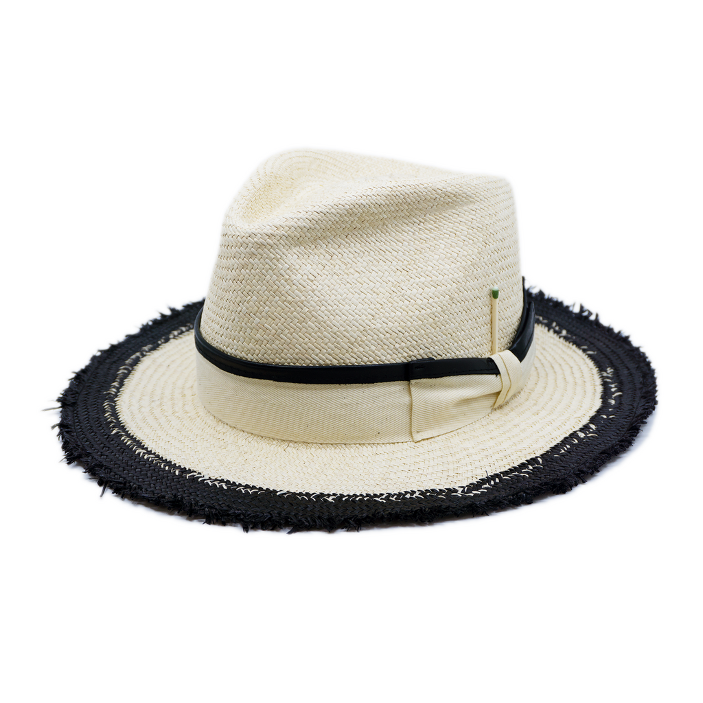 100% Ecuadorian straw in Black and White  1 ½” Leather trimmed grosgrain band with black leather back bow   Woven in Ecuador Frayed brim Made in USA