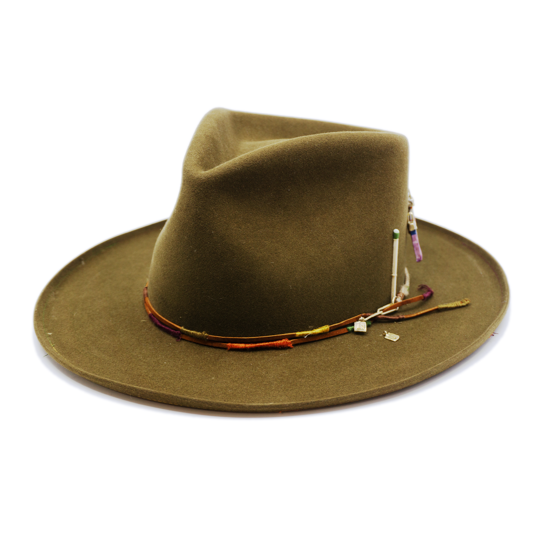 100% felt hat in New Green  Western  Weight   Braided twine and suede cord   with multicolor accents  threads   Italian ceramic pieces  on crown  Pencil curled  brim  Made in USA