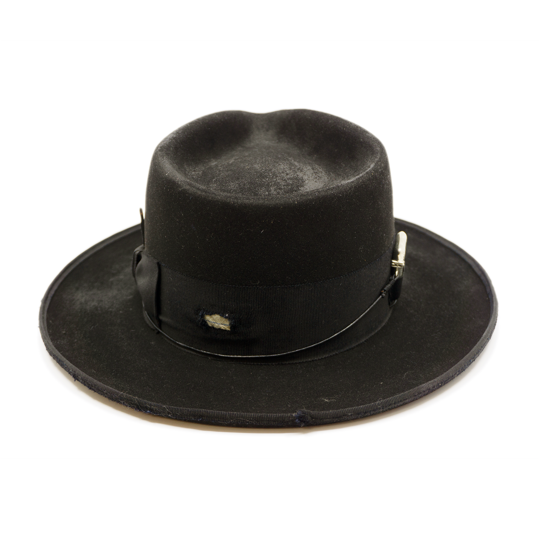 100% felt hat in Blackout  Western  Weight    2” distressed double layered band and bow  Distressed   Engraved NF silver matchstick   Holder in leather pocket   12mm distressed binding  Pencil curled  brim  Made in USA