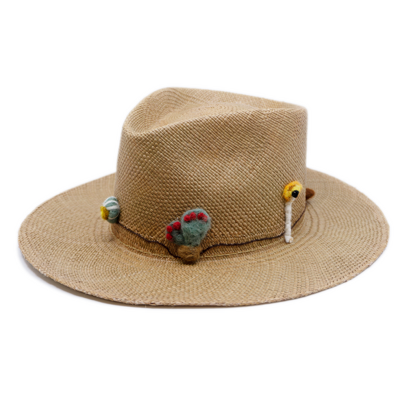 100% Ecuadorian straw in Natural Brown  Handmade  wool cacti accents and lit matchstick band  Woven in Ecuador  Flat brim  Made in USA