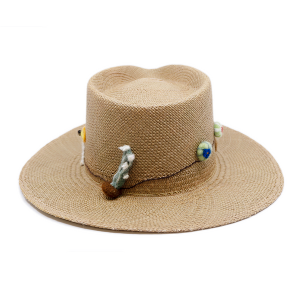 100% Ecuadorian straw in Natural Brown  Handmade  wool cacti accents and lit matchstick band  Woven in Ecuador  Flat brim  Made in USA