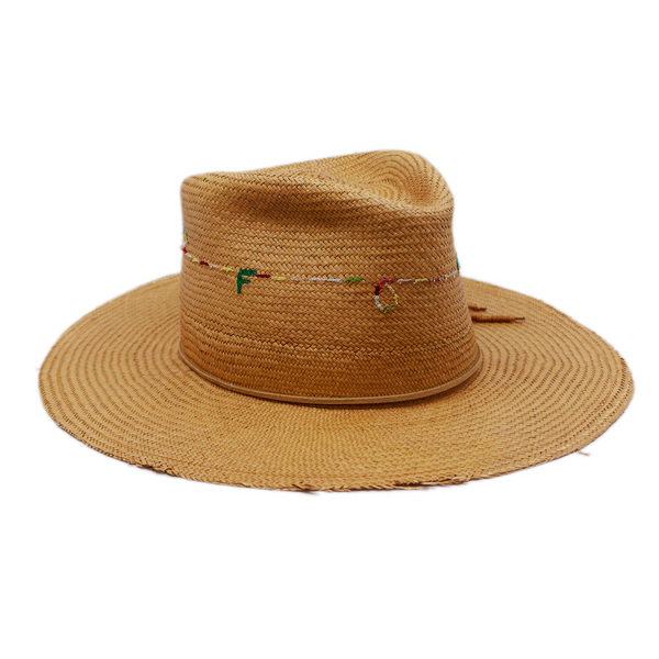 100% Ecuadorian straw in Natural Brown  Suede cord with japanese wax   thread ends band  Multicolor N—-F embroidery around crown   Woven in Ecuador  Lightly frayed brim  Made in USA  