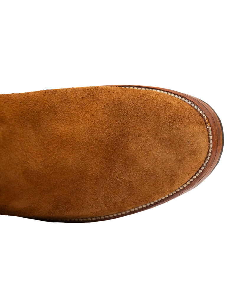 Top-down view of the Silo Roper, a whiskey brown suede roper boot toe in rough-out hide.