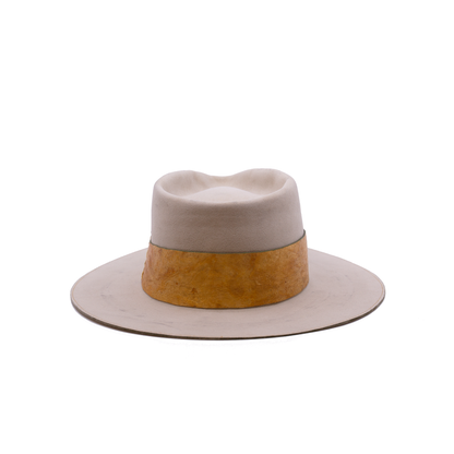 100% Dress Weight Felt in Côte Sauvage  2" Reishi™ band MycoWorks Fine Mycelium™ leather alternative with green edge finishing  Single row ticking with green edge finishing  Burnt silver NF matchstick  Flat brim  Made in California