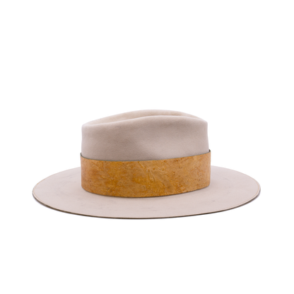 100% Dress Weight Felt in Côte Sauvage  2" Reishi™ band MycoWorks Fine Mycelium™ leather alternative with green edge finishing  Single row ticking with green edge finishing  Burnt silver NF matchstick  Flat brim  Made in California