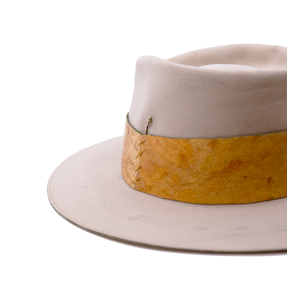 100% Dress Weight Felt in Côte Sauvage  2" Reishi™ band MycoWorks Fine Mycelium™ leather alternative with green edge finishing  Single row ticking with green edge finishing  Burnt silver NF matchstick  Flat brim  Made in California