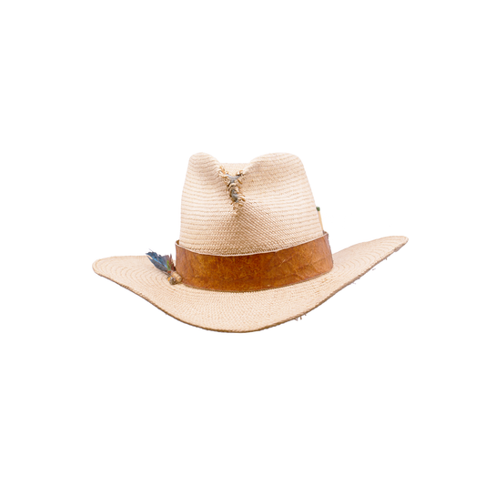 100% Straw Hat in Natural  Ecuadorian Straw Crown  1 1/2" Reishi™ band MycoWorks Fine Mycelium™ leather alternative   Molt harvested parrot feather with silver and gold nuggets  NF fabric patched center pinch  NF western flanged brim  Woven in Ecuador  Made in California