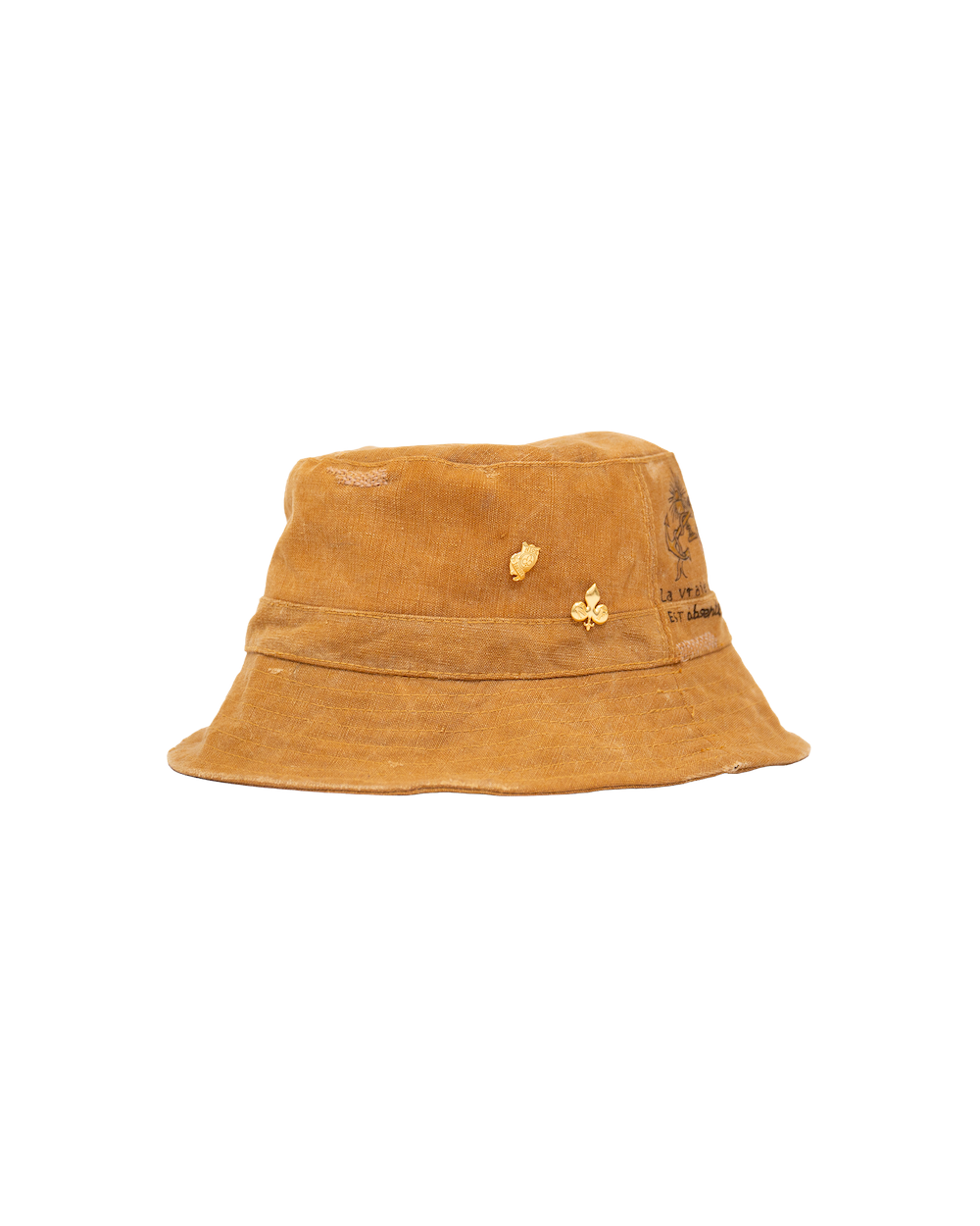 Sage Bucket mustard yellow waxed canvas bucket hat featuring two small gold-plated pins and dark ink illustrations on the side.