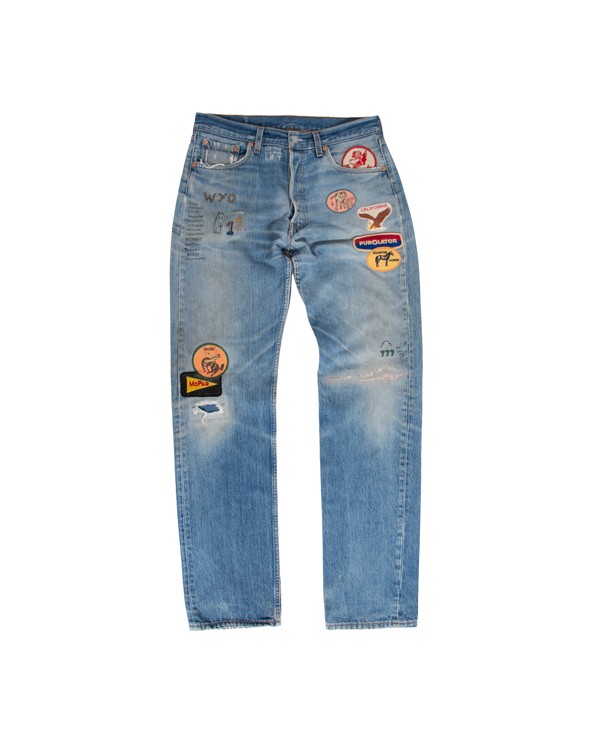 Rodeo Denim light-wash USA-made Levi’s 501 jeans featuring various embroidered patches, including a California eagle, Mopar logo, and hand-written text details.