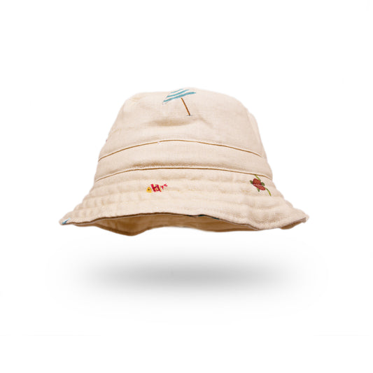 100% linen bucket hat in cream  Cream printed linen   Printed NF beach icons throughout  Made in LA