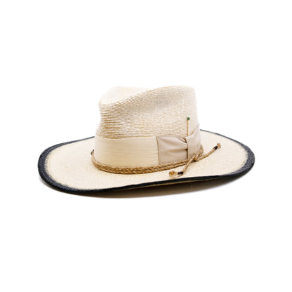 Ococ 100% Mexican straw in Cream and Black  2" cream herringbone band and leather bow  Wrapped twine band  3 1/2"  Two-tone brim  Woven in Mexico  Subtle western flanged brim  Made in USA