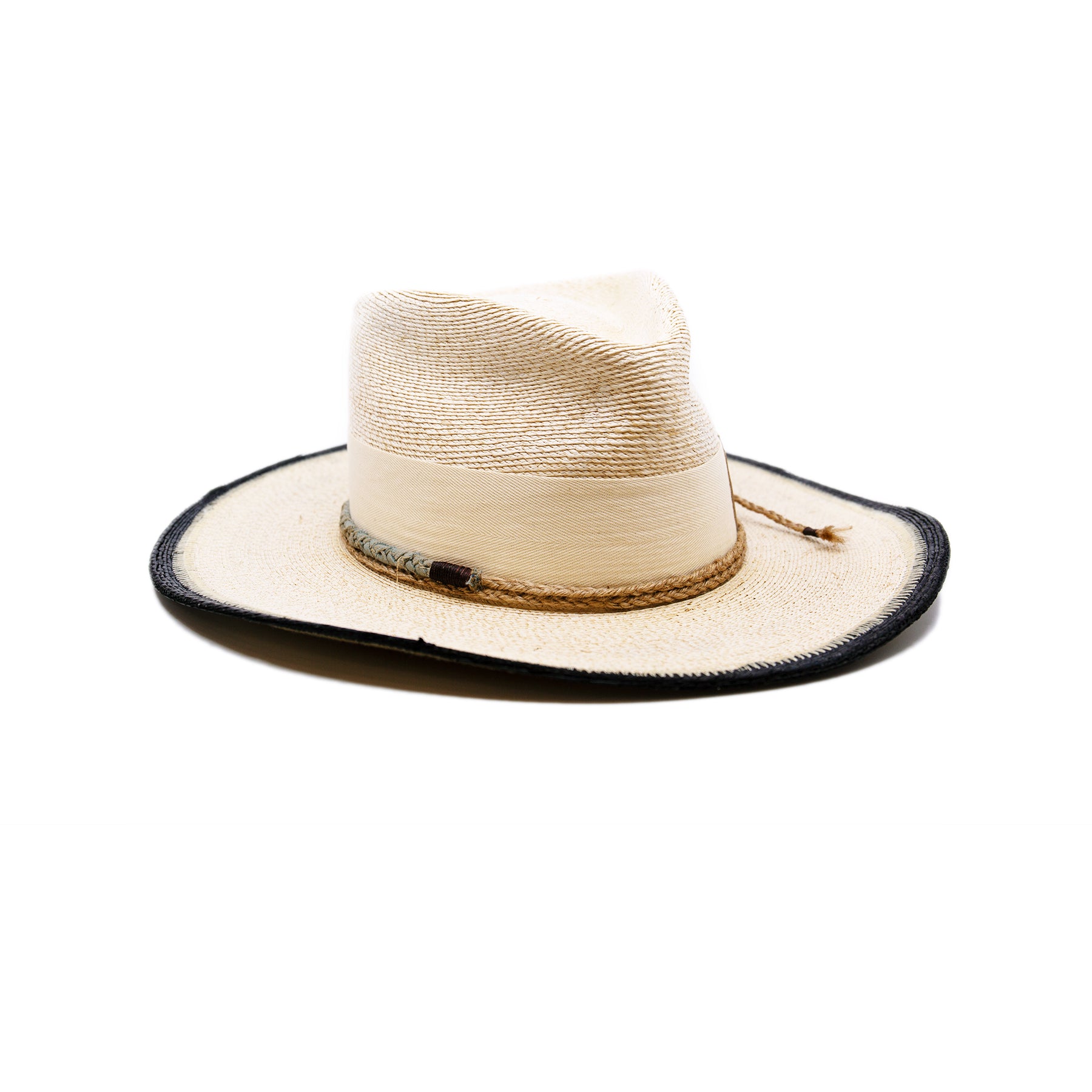 100% Mexican straw in Cream and Black  2" cream herringbone band and leather bow  Wrapped twine band  3 1/2"  Two-tone brim  Woven in Mexico  Subtle western flanged brim  Made in USA