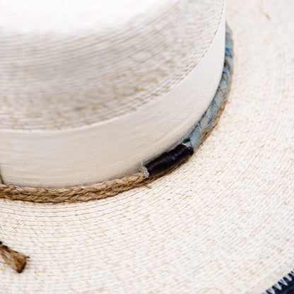 100% Mexican straw in Cream and Black  2" cream herringbone band and leather bow  Wrapped twine band  3 1/2"  Two-tone brim  Woven in Mexico  Subtle western flanged brim  Made in USA