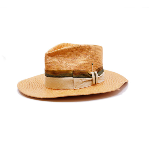 100%  Ecuadorian straw hat  in Pale Orange   2” Silk band with tie dyed silk binding  Woven in Ecuador  Flat brim   Made in USA 