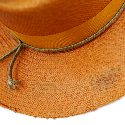 100%  Ecuadorian straw hat in Tangerine   2” tonal grosgrain and woven herringbone 2-ply band and bow  Distressed and inlay patchwork    Woven in Ecuador  Wavy brim   Made in USA 