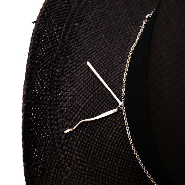 100%  Ecuadorian straw hat in Black   1 ½” herringbone band & Bow  Alternating silver chain with silver leaf accouterments     Woven in Ecuador  Western flanged brim  Made in USA 