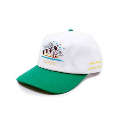 Aspen Tourist Cap  100% cotton in Cream/Green  Multicolor Embroidered 'Aspen' graphic  Yellow embroidered “Where the bluebirds sing and there’s a whiskey spring” message on side  Embroidered matchstick on reverse side  One size fits all  Made in Los Angeles 