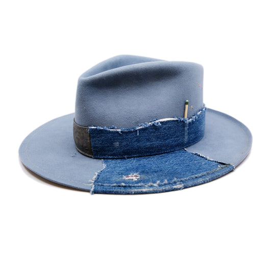 Lynn Hat  100% felt hat in Powder Blue  Dress Weight  Hand cut band from deadstock selvedge denim and calfskin leather  1/4" denim patch on brim with mending  1⁄4“ ticking on brim  Multicolor accent hand embroidery  Back pencil curled brim  Made in USA