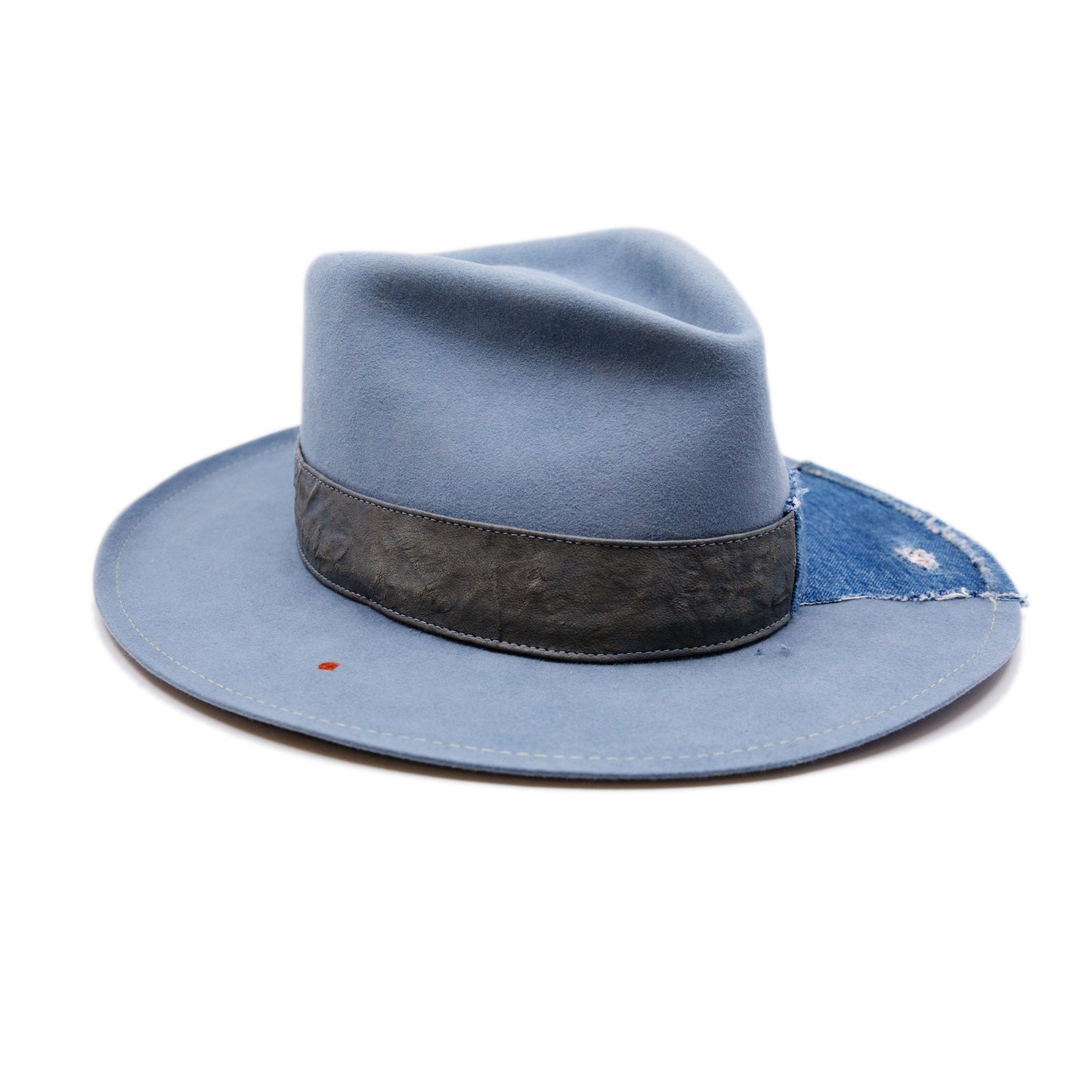 Lynn Hat  100% felt hat in Powder Blue  Dress Weight  Hand cut band from deadstock selvedge denim and calfskin leather  1/4" denim patch on brim with mending  1⁄4“ ticking on brim  Multicolor accent hand embroidery  Back pencil curled brim  Made in USA