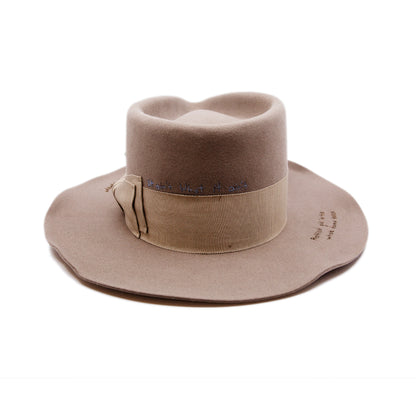 Moonshiner Hat  100% felt hat in Natural  Western Weight  2” grosgrain Butterfly Bow  "Sleepy Holler phrases branded and hand embroidered throughout crown and brim"  Wavy brim  Made in USA