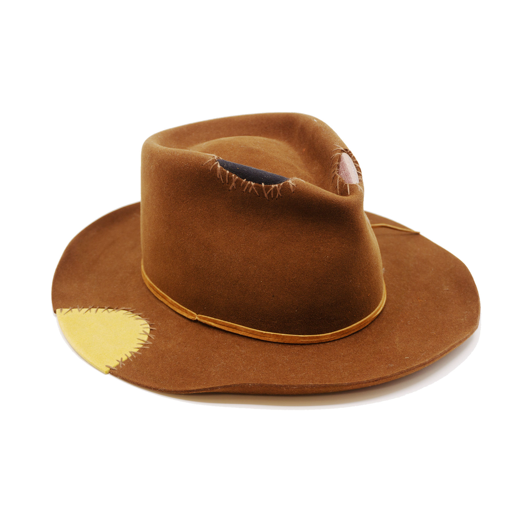 100% felt hat in Pimp Brown   Western Weight   Tonal suede lace wrapped twice   4 cut outs with two felt patches and two fabric patches  Tonal whip stitching   Wavy brim   Made in USA