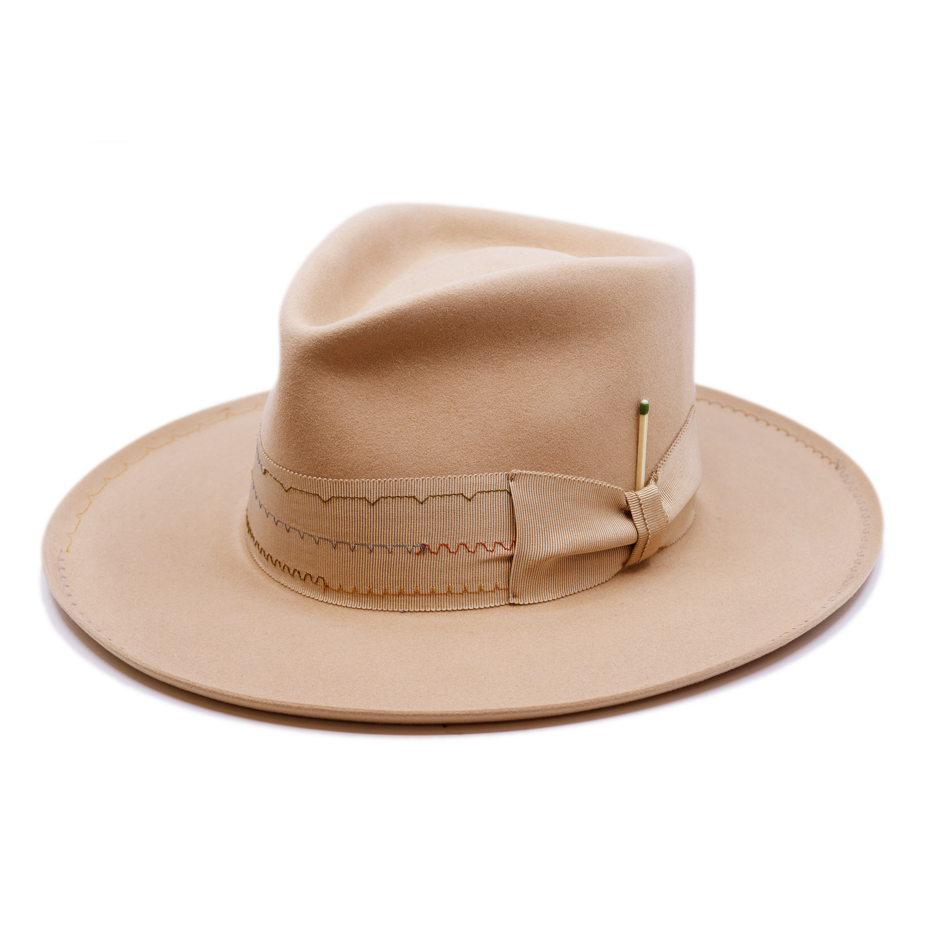 100% felt hat in Nude  Western Weight   2” tonal grosgrain with zig zag multi color stitching on band   2" tonal grosgrain bow  Multi colored zig zag stitching on brim   Pencil curled brim  Made in USA