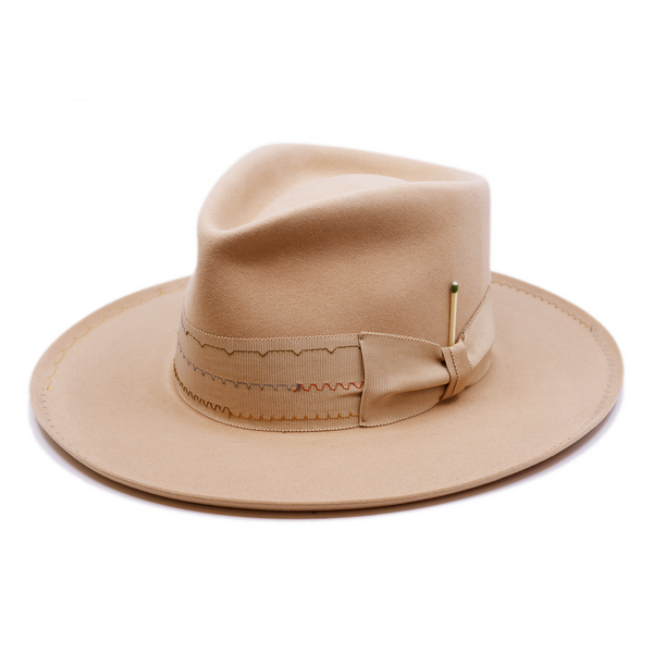 100% felt hat in Nude  Western Weight   2” tonal grosgrain with zig zag multi color stitching on band   2" tonal grosgrain bow  Multi colored zig zag stitching on brim   Pencil curled brim  Made in USA