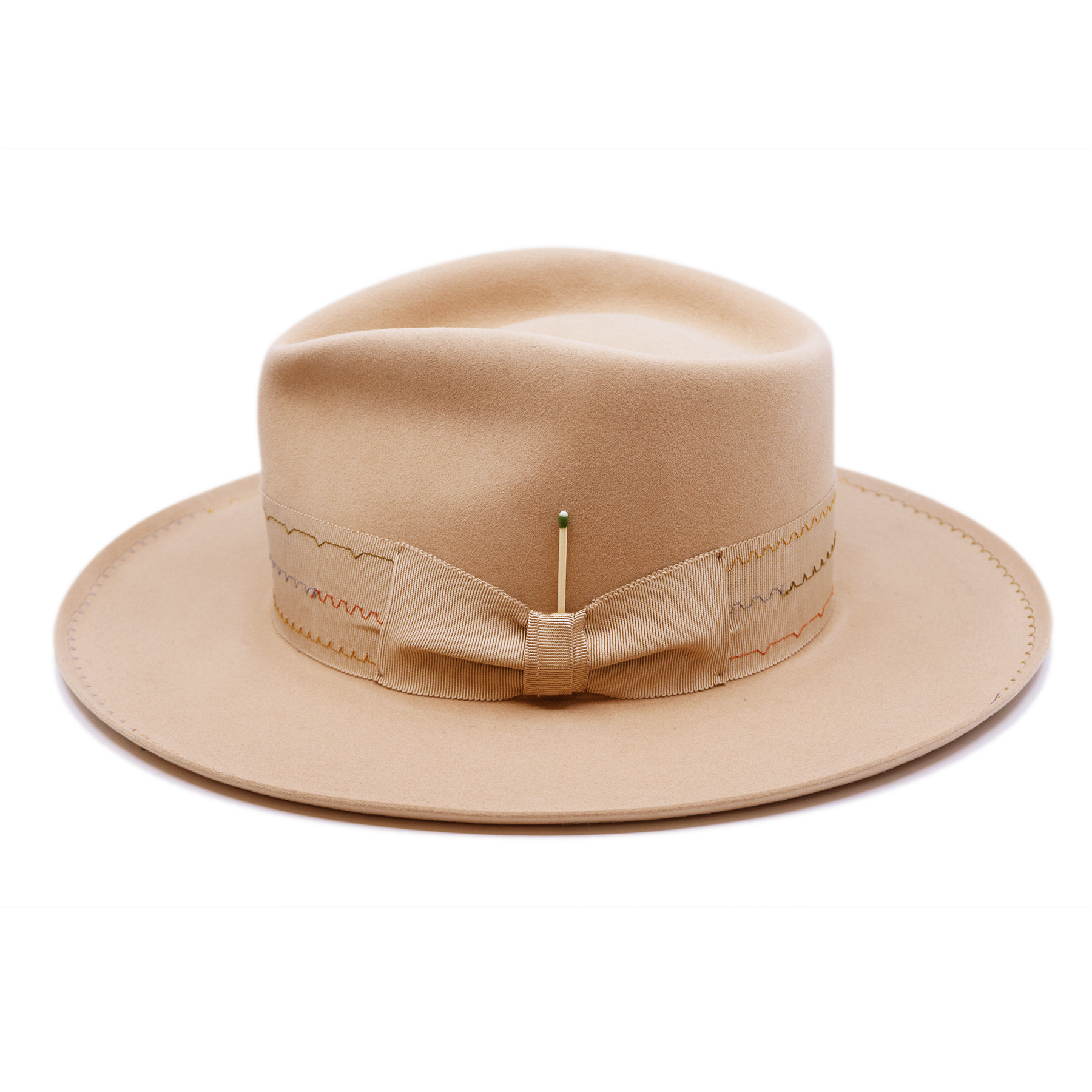 100% felt hat in Nude  Western Weight   2” tonal grosgrain with zig zag multi color stitching on band   2" tonal grosgrain bow  Multi colored zig zag stitching on brim   Pencil curled brim  Made in USA
