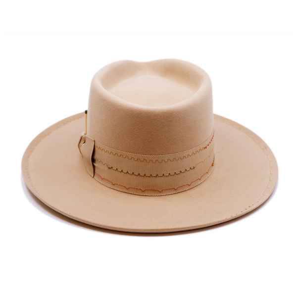 100% felt hat in Nude  Western Weight   2” tonal grosgrain with zig zag multi color stitching on band   2" tonal grosgrain bow  Multi colored zig zag stitching on brim   Pencil curled brim  Made in USA