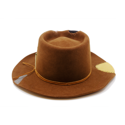 100% felt hat in Pimp Brown   Western Weight   Tonal suede lace wrapped twice   4 cut outs with two felt patches and two fabric patches  Tonal whip stitching   Wavy brim   Made in USA