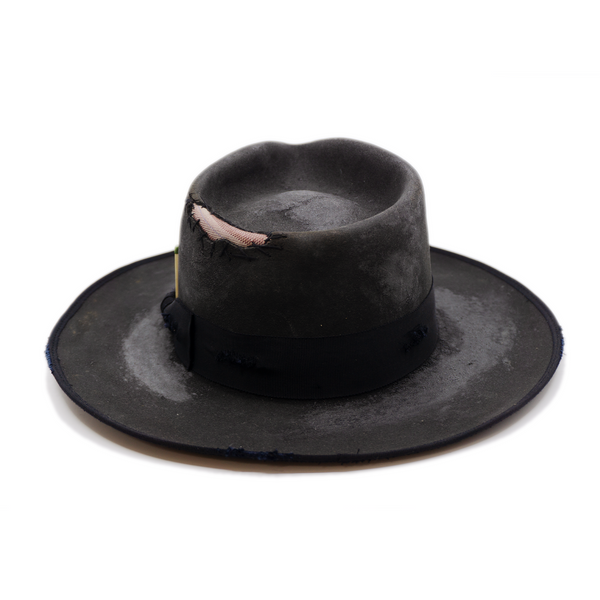 100% felt hat in Night Crawler   Western Weight   1 ½ “ distressed tonal grosgrain   NF fabric patchwork on crown   Full 9mm distressed binding   Distressed   Lighty flanged brim  Made in USA