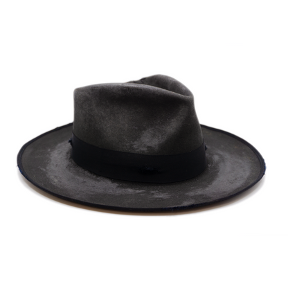 100% felt hat in Night Crawler   Western Weight   1 ½ “ distressed tonal grosgrain   NF fabric patchwork on crown   Full 9mm distressed binding   Distressed   Lighty flanged brim  Made in USA