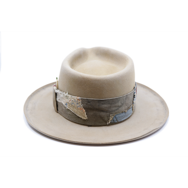 100% felt hat in Silver Belly   Western Weight  Coffee dye   2” multi fabric band   Velvet with tonal grosgrain center bow   Light blue zig zag stitching on brim   Pencil curled brim  Made in USA