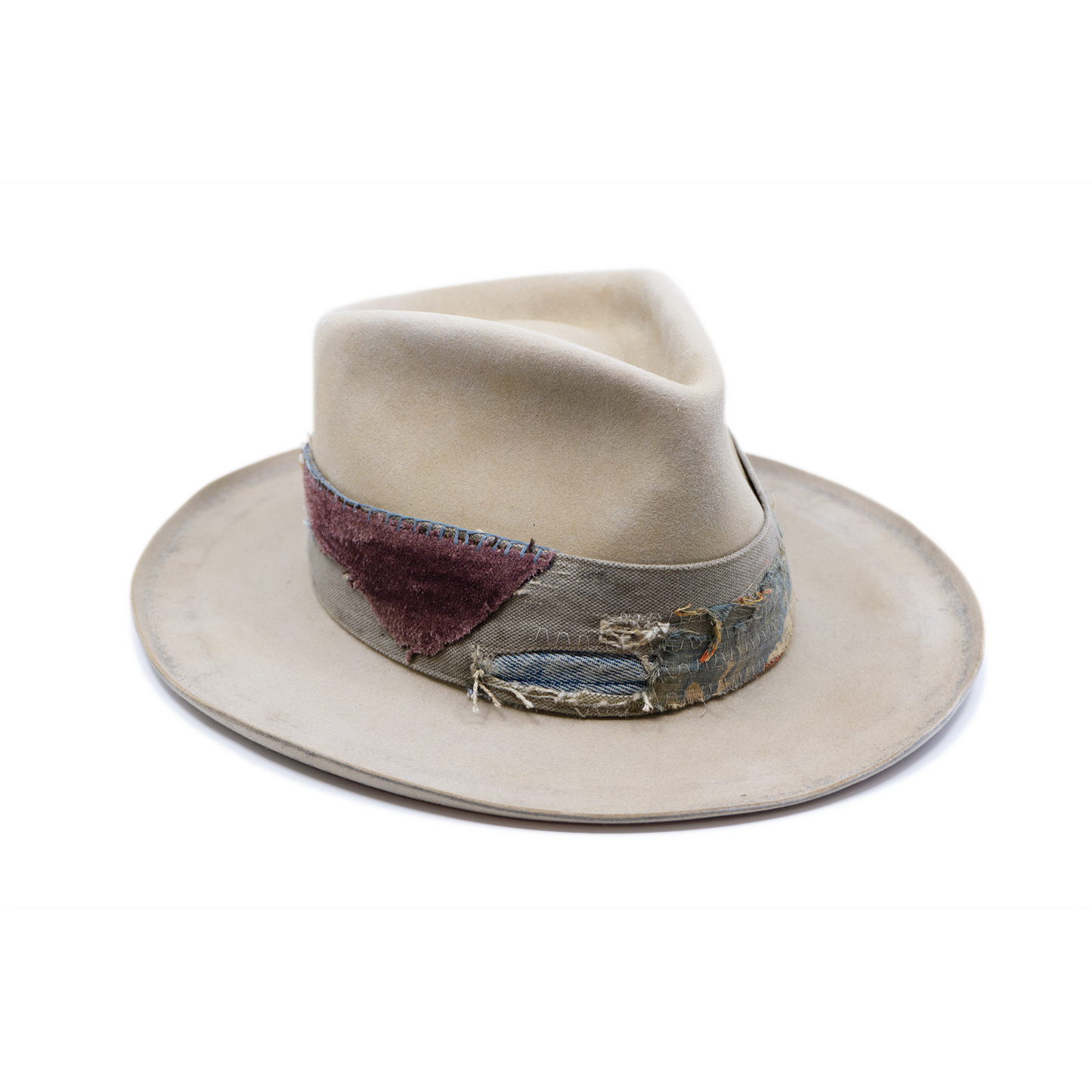 100% felt hat in Silver Belly   Western Weight  Coffee dye   2” multi fabric band   Velvet with tonal grosgrain center bow   Light blue zig zag stitching on brim   Pencil curled brim  Made in USA