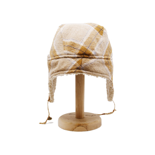 Buttermilk Trapper Hat  Shearling Flannel   Braided twine and metallic button closure  Gold plated and ceramic accouterments will vary from hat to hat  Made in Los Angeles