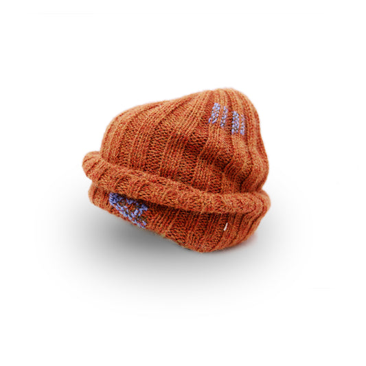 100% Baby Alpaca wool ribbed beanie in Rusted Blade  Multicolored hand-embroidered mending  Made in Los Angeles