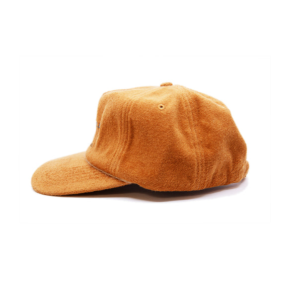 Camel terrycloth baseball cap  Natural hemp braided twine cord along brim  Beach Umbrella Rentals hotline graphic embroidered at front  Embroidered matchstick on reverse side  One size fits all  Made in Los Angeles   