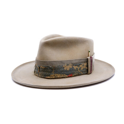 100% felt hat in Silver Belly   Western Weight  Coffee dye   2” multi fabric band   Velvet with tonal grosgrain center bow   Light blue zig zag stitching on brim   Pencil curled brim  Made in USA